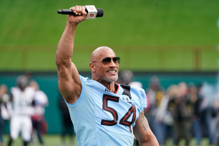 Feb 18, 2023; Arlington, TX, USA; XFL owner Dwayne Johnson talks on the field prior to game between the Vegas Vipers and the Arlington Renegades at Choctaw Stadium. Mandatory Credit: Raymond Carlin III-USA TODAY Sports
